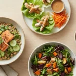 Gluten-free lunch bowls with vegetables, grains, and protein on a table