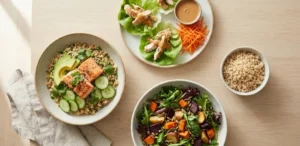 Gluten-free lunch bowls with vegetables, grains, and protein on a table