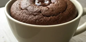 5-minute chocolate mug cake with a fudgy center in a ceramic mug